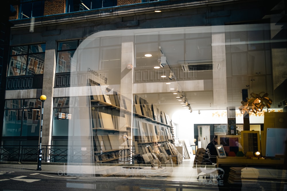 a store front with a large amount of books in the window