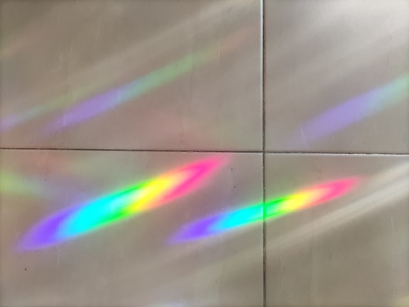 A colorful light display illuminating a dance floor.