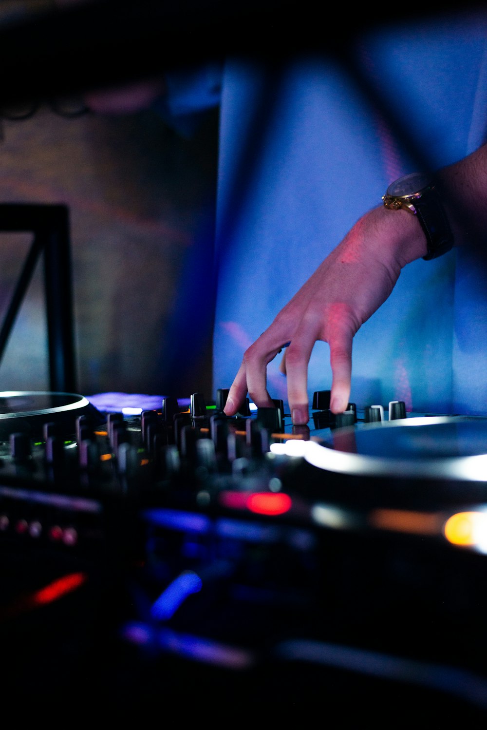 a dj mixing music in a dark room