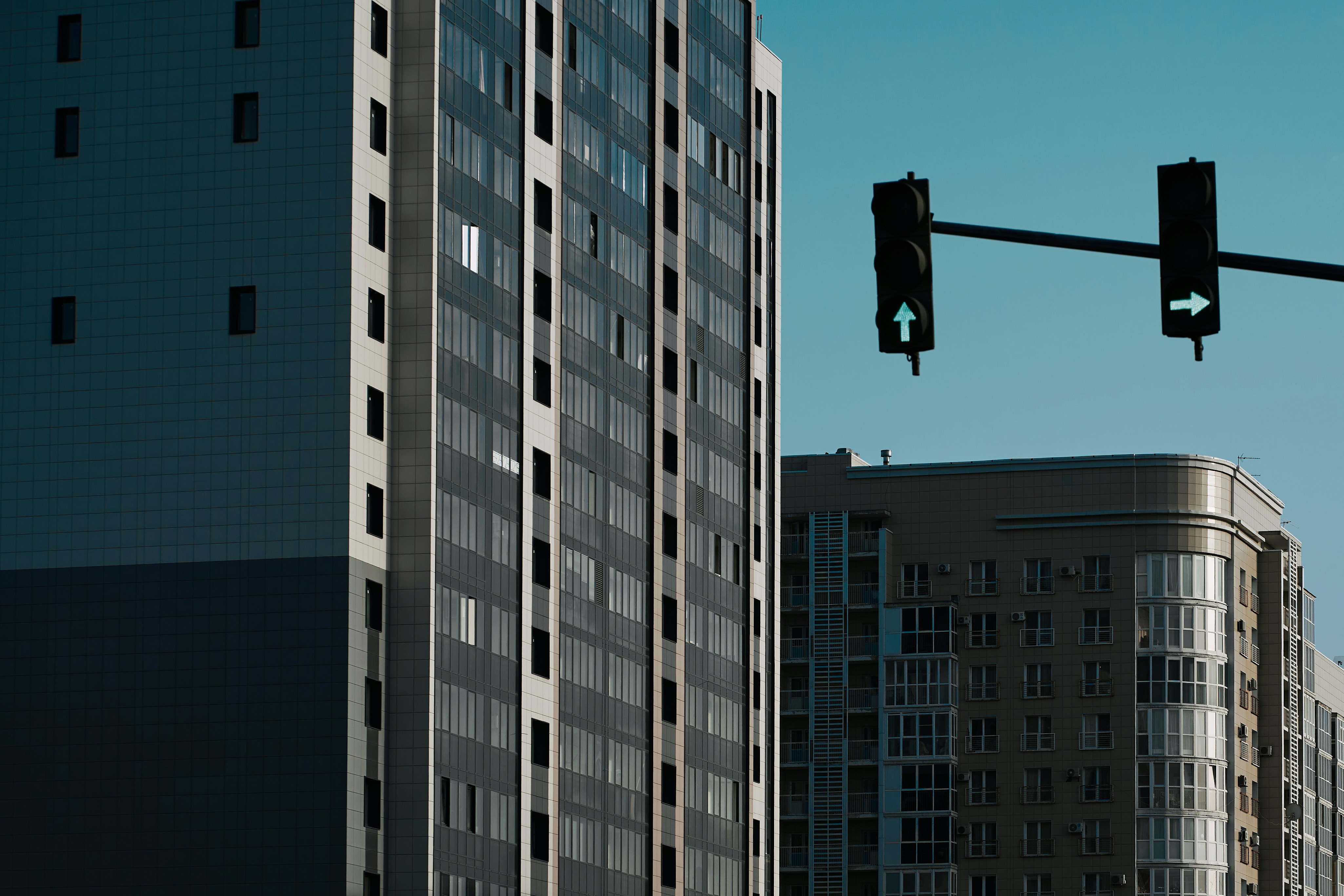 a couple of tall buildings next to each other