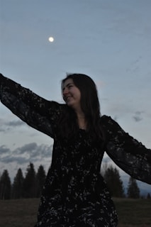 Model wearing a flowing dress under moonlight, capturing the essence of lunaria style