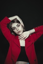 A confident portrait with deep navy and crimson colors highlighting premium advertising photography.