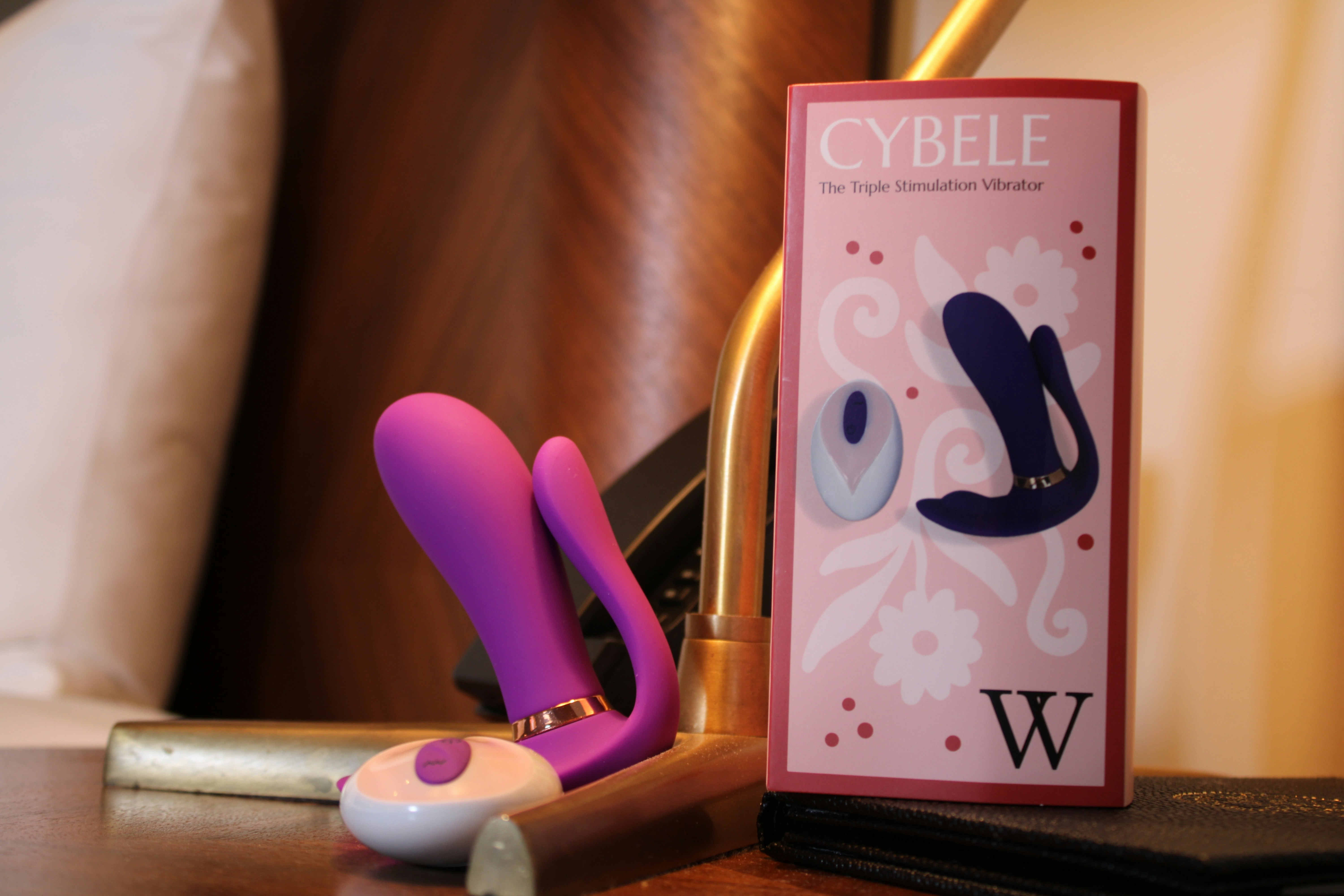 A triple stimulation vibrator is on the table in the hotel.
