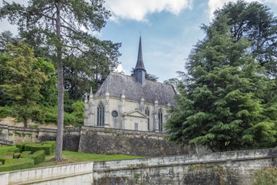 A historic Lutheran church building surrounded by lush greenery.