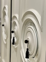 A close-up of intricate woodwork on a cabinet door.
