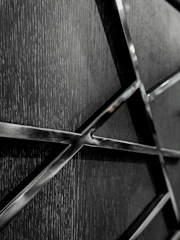 Subtle metallic textures overlaying a global network map.