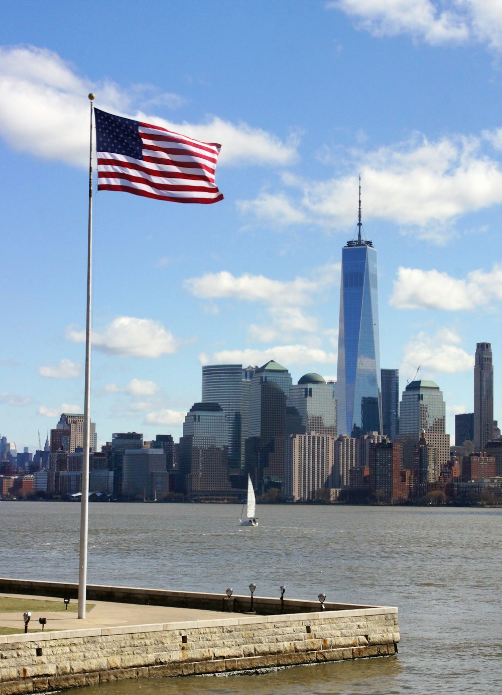 a flag flying in front of a large city