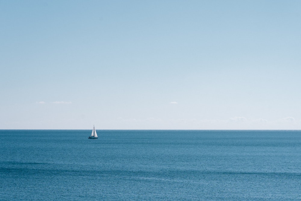 a sailboat in the middle of a large body of water