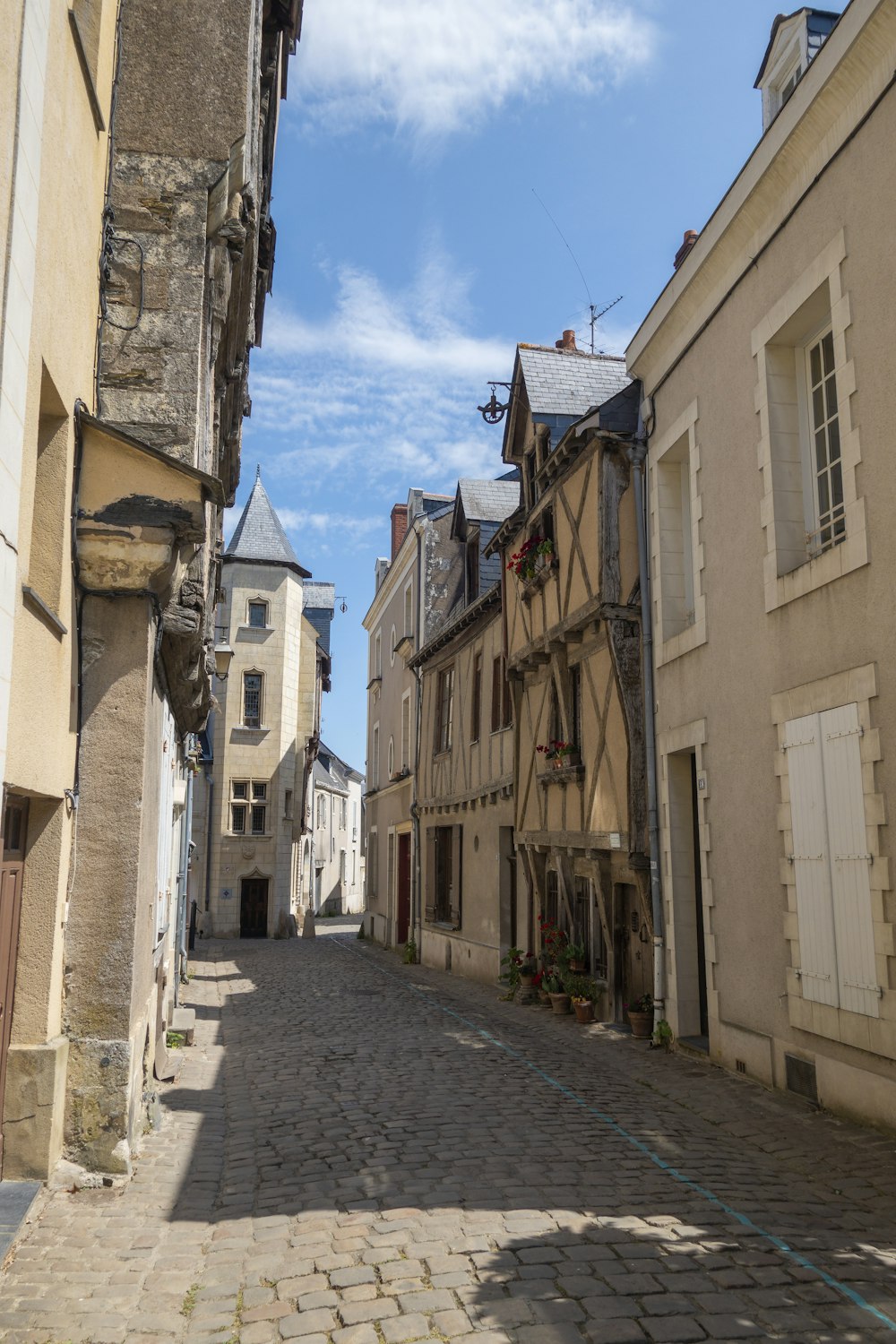 a cobblestone street in a small town