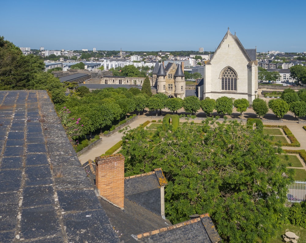 an aerial view of a church in a city