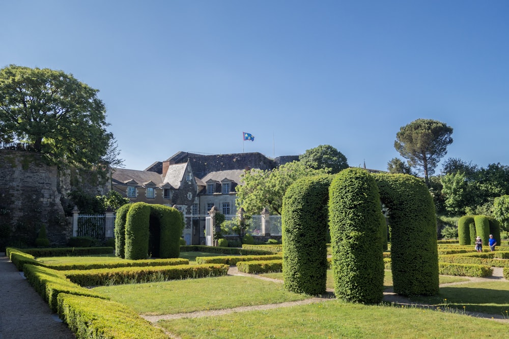 a large house with a garden in front of it