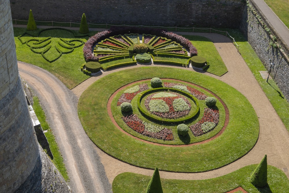 an aerial view of a circular garden in a castle