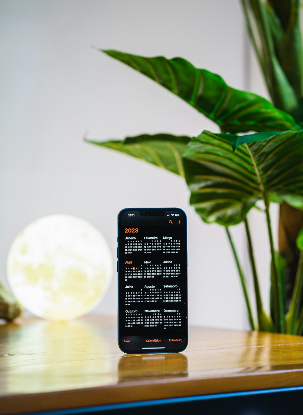 a remote control sitting on top of a wooden table