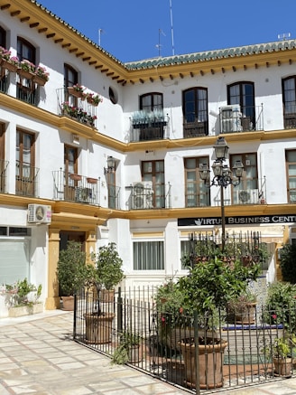 a white building with lots of windows and balconies