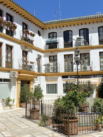 a white building with lots of windows and balconies