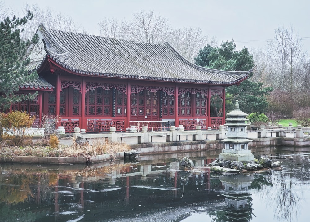 a building with a pond in front of it