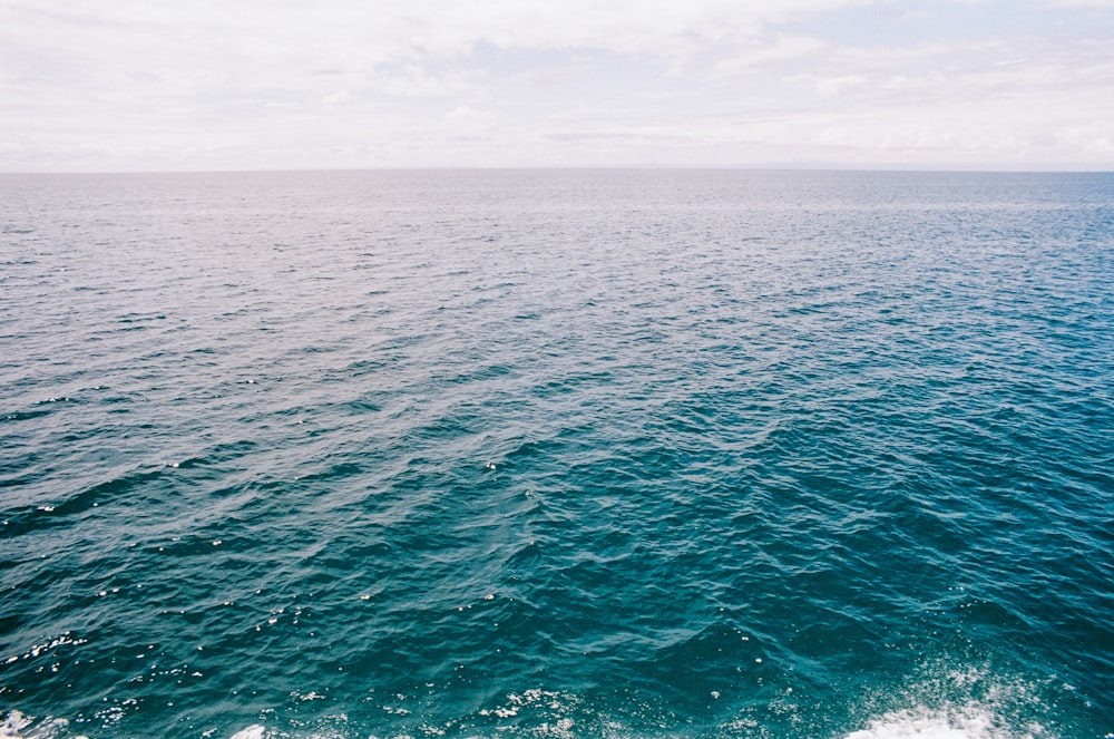 a body of water with a boat in the distance