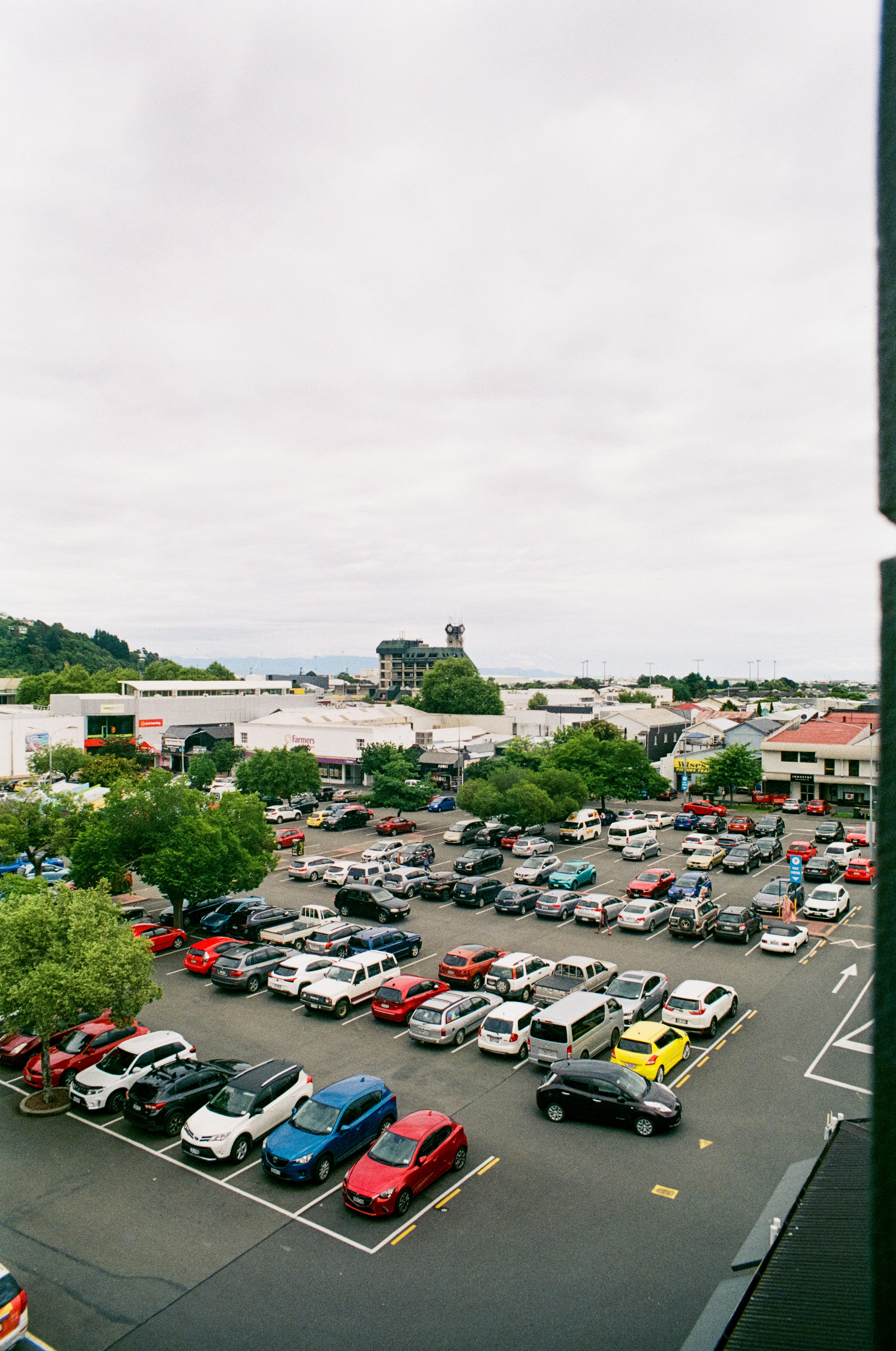 a parking lot filled with lots of parked cars