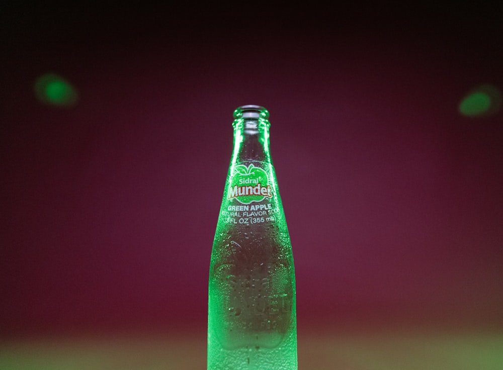 a close up of a bottle of water on a table