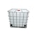 A large, white industrial container, often referred to as an Intermediate Bulk Container (IBC), is enclosed in a metal cage for support and stability. The container features a red cap on the top.