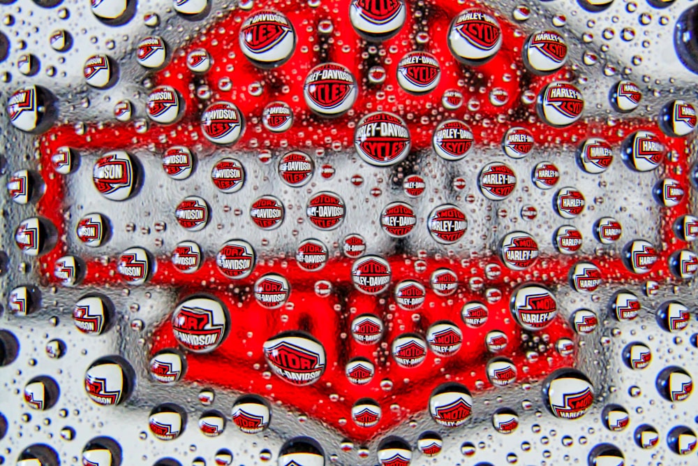 a close up of water droplets on a red object