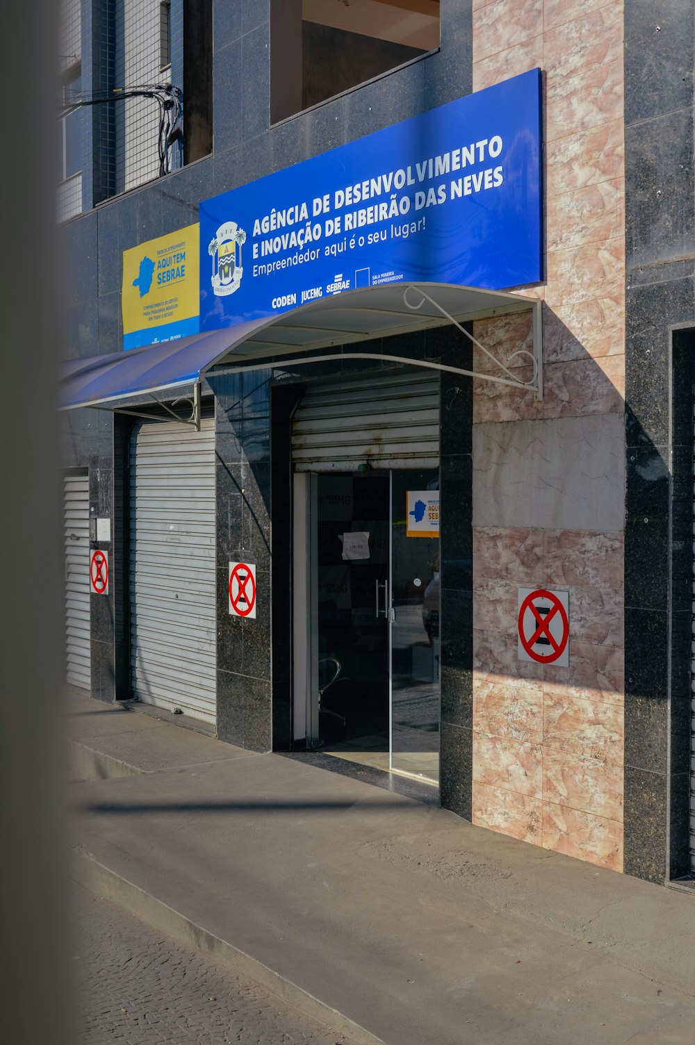 a building with a blue sign on the side of it