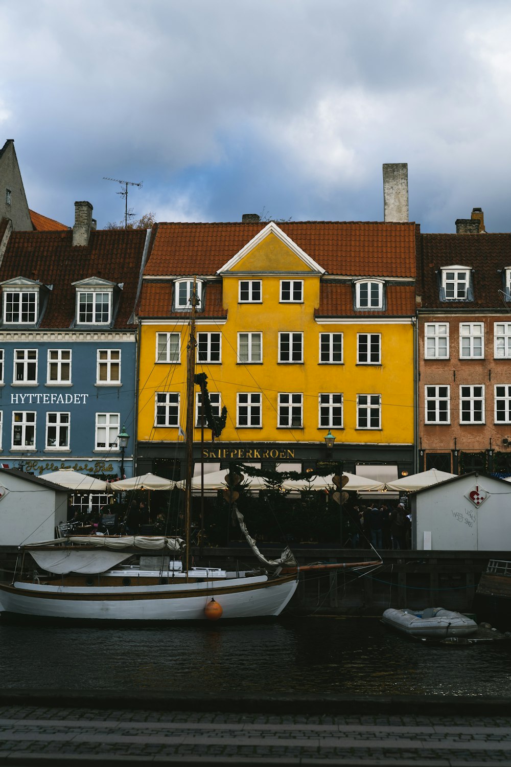 a row of buildings next to a body of water