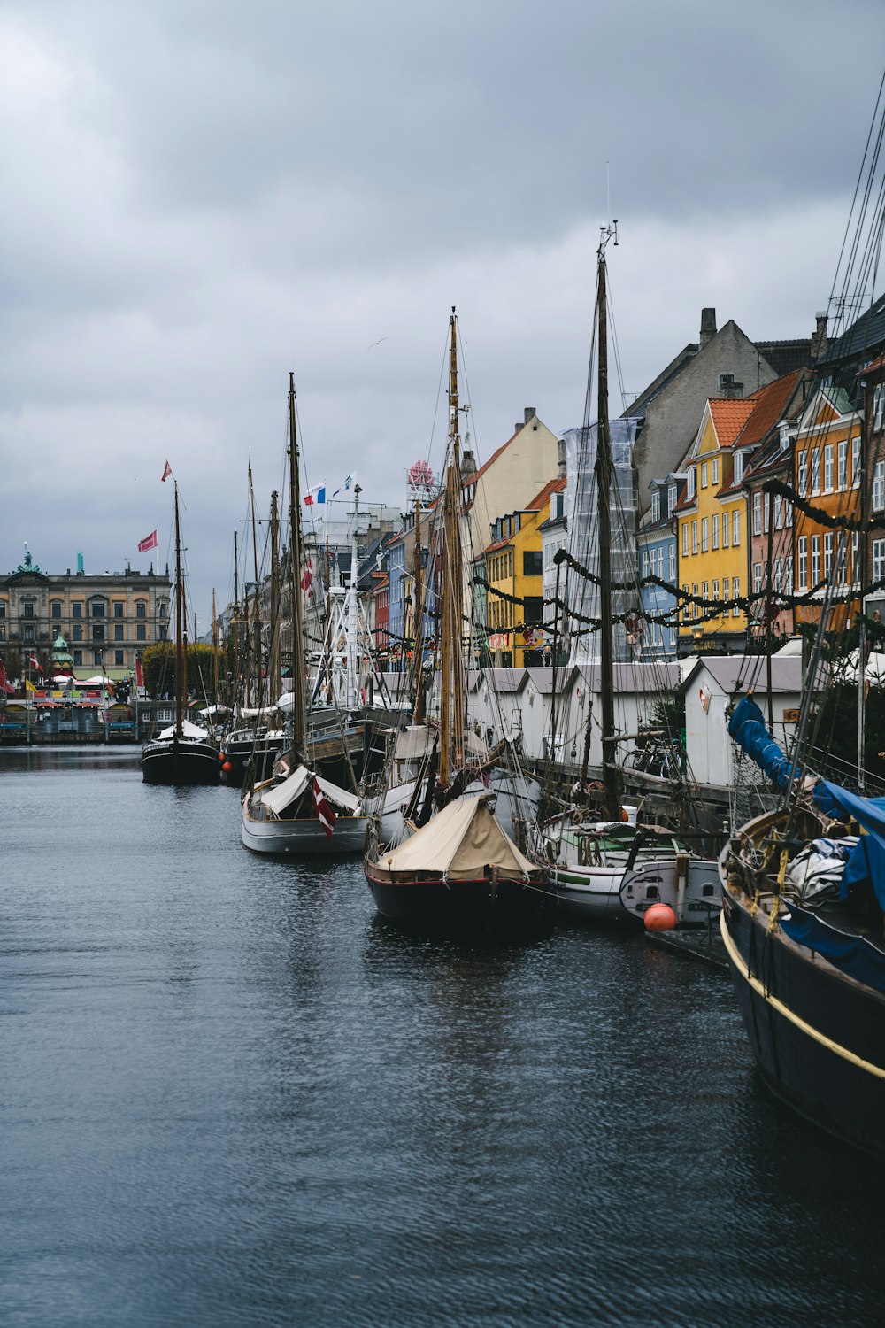 a group of boats that are sitting in the water