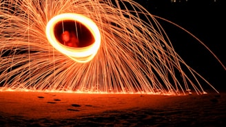 Slow-motion shot of a Tesla coil releasing crackling bolts of lightning into the dark.