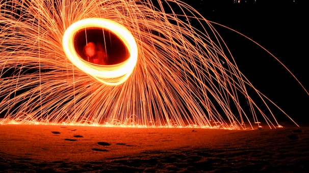 Slow-motion shot of a Tesla coil releasing crackling bolts of lightning into the dark.