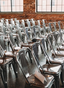 a room filled with lots of metal chairs