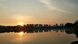 Scenic view of Bhopal city’s lakeside at dawn with reflections on the water.