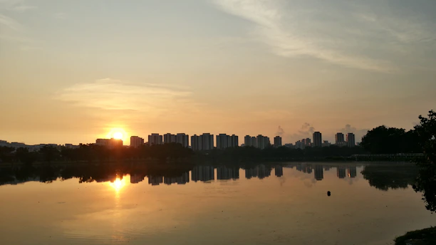 A serene Chicago skyline at dawn with soft navy blue and slate gray hues reflecting on Lake Michigan.