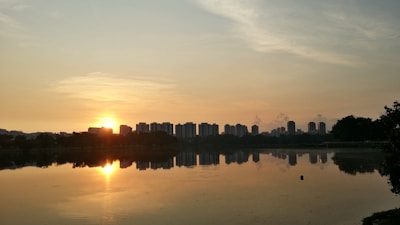 Scenic view of Bhopal city’s lakeside at dawn with reflections on the water.