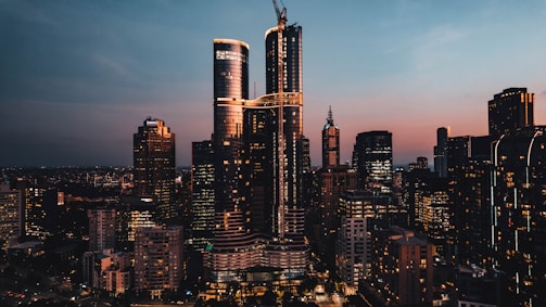 City skyline featuring innovative and eco-friendly buildings at sunset.