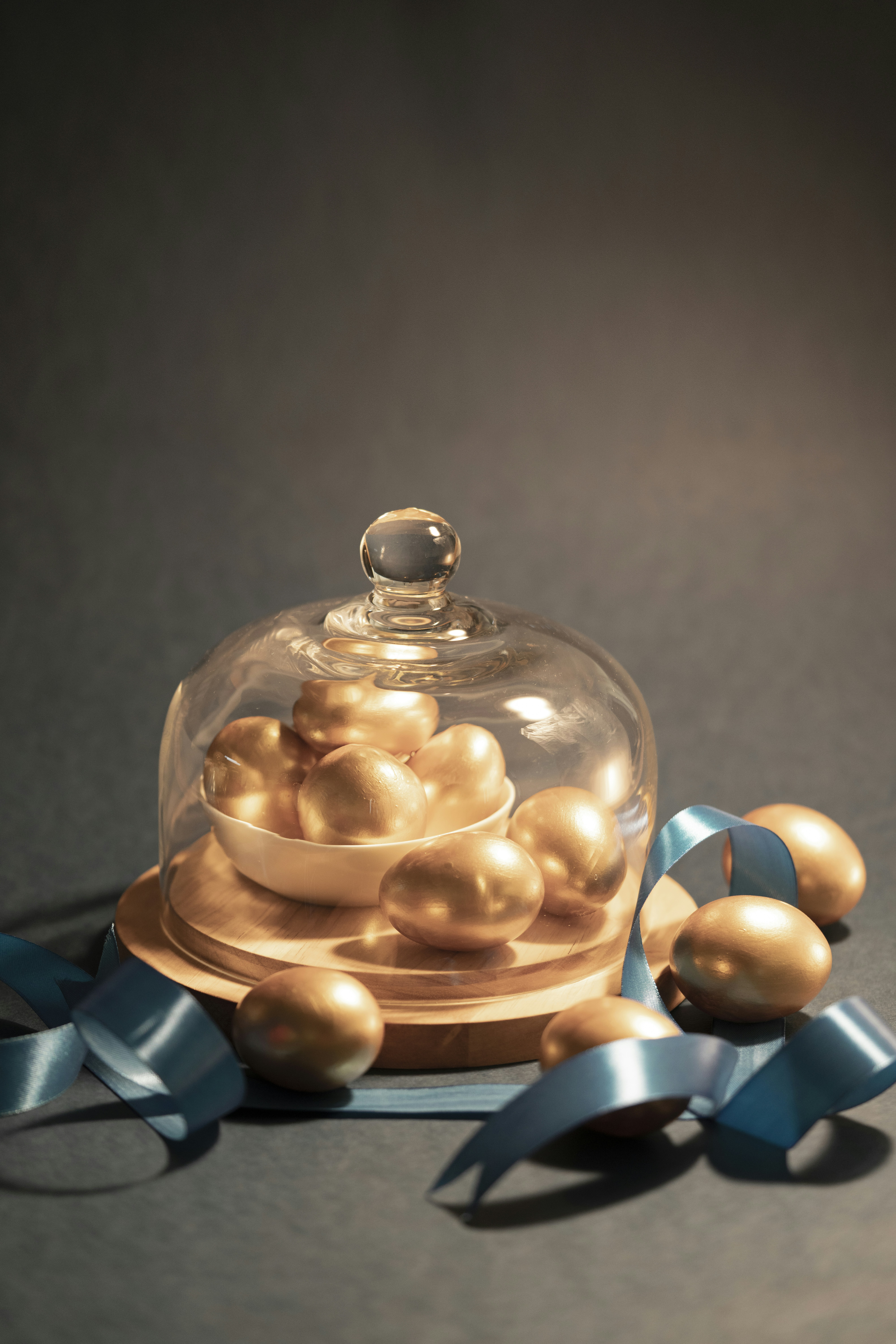 Golden eggs in transparent glass dome