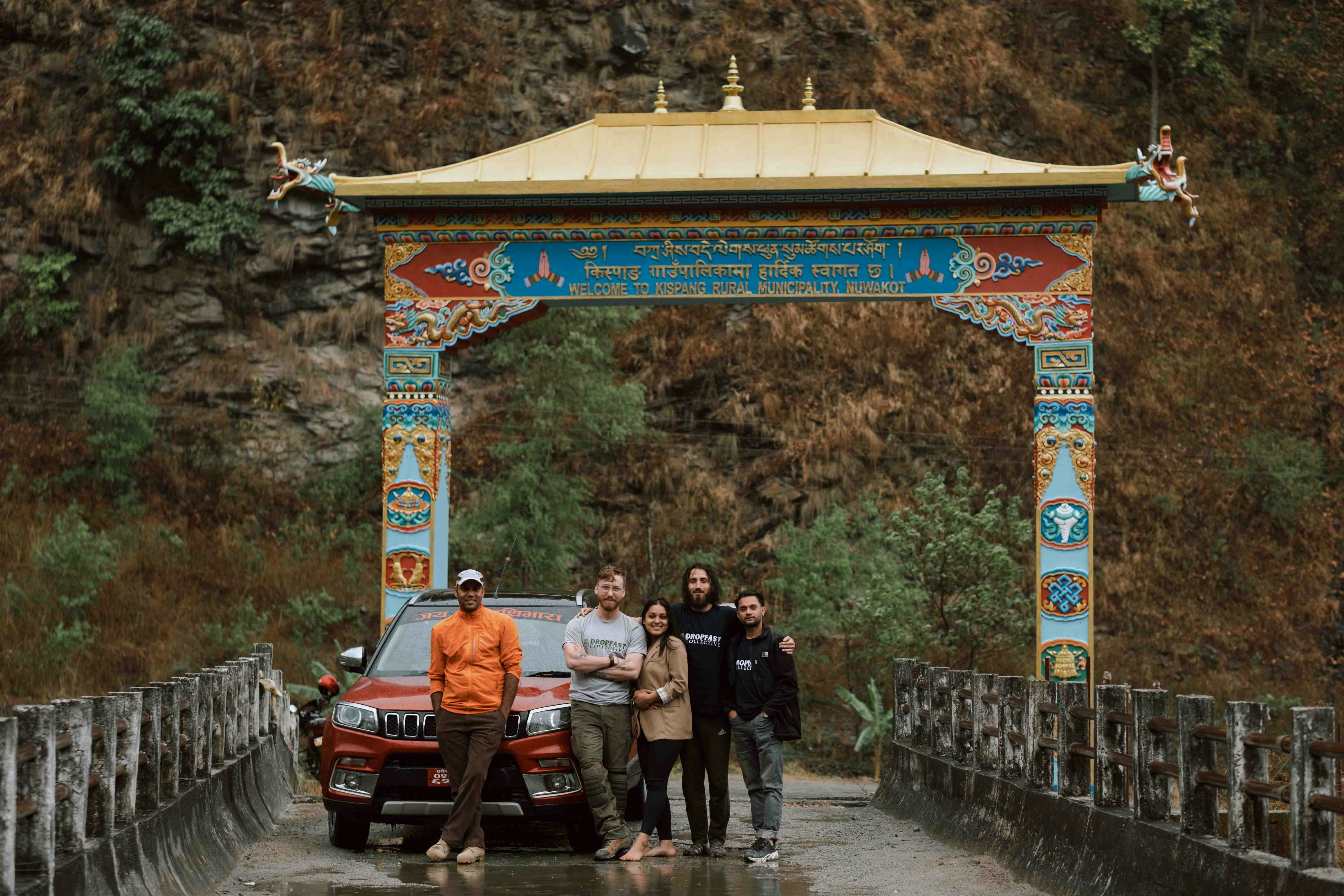a group of people standing on a bridge