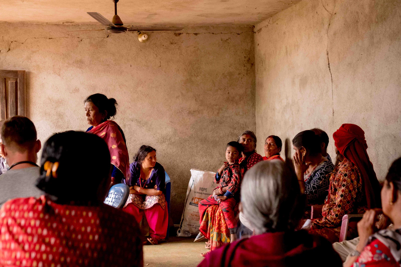 Women seated around a room in a group discussion