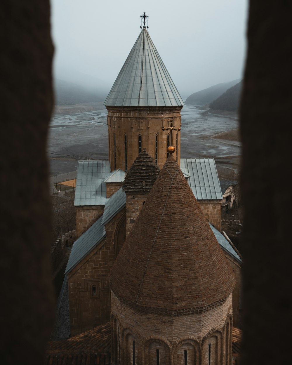 a church with a steeple and a cross on top