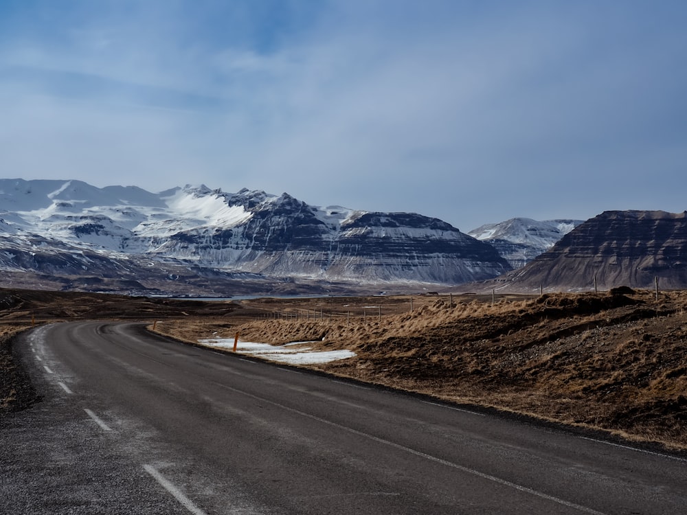 a road with a mountain range in the background