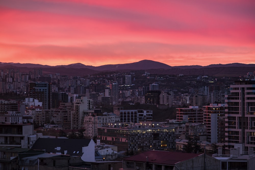 a view of a city with mountains in the background