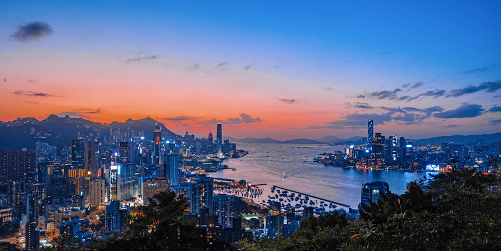 a view of a city at night from the top of a hill