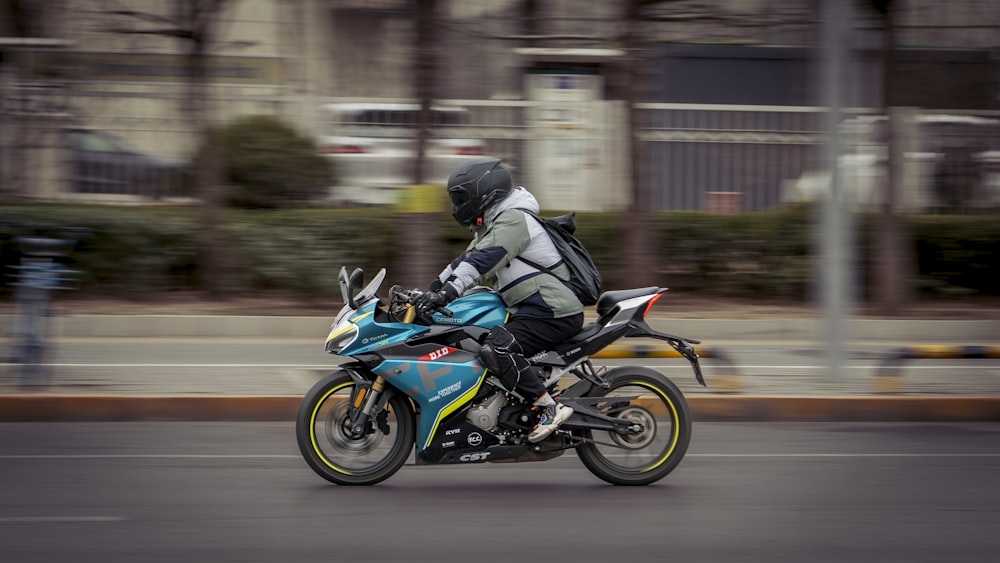 a person riding a motorcycle on a city street