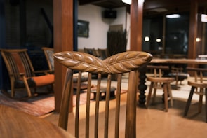 Beautifully designed wooden chairs in a cozy setting.