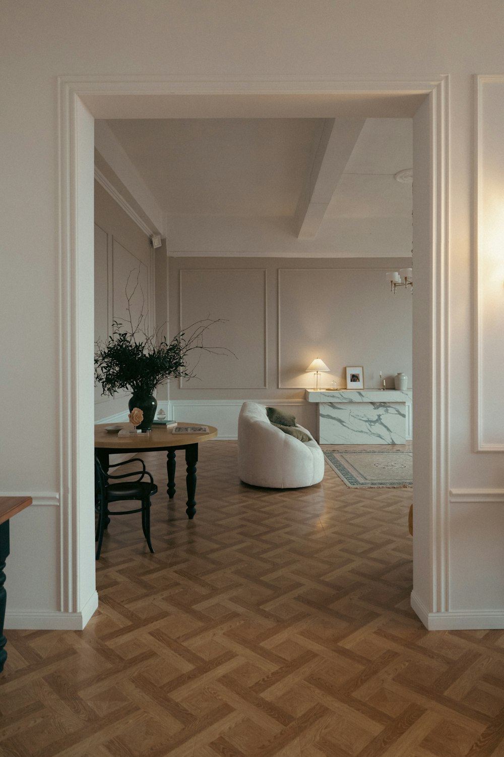 a living room filled with furniture and a wooden floor