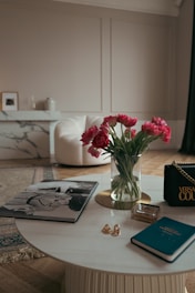 Close-up of a luxurious marble coffee table with gold accents in a modern living room.