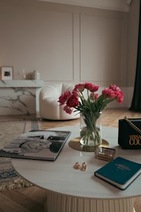 Close-up of a luxurious marble coffee table with gold accents in a modern living room.