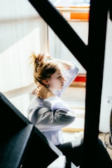 a woman with her hair in a high bun