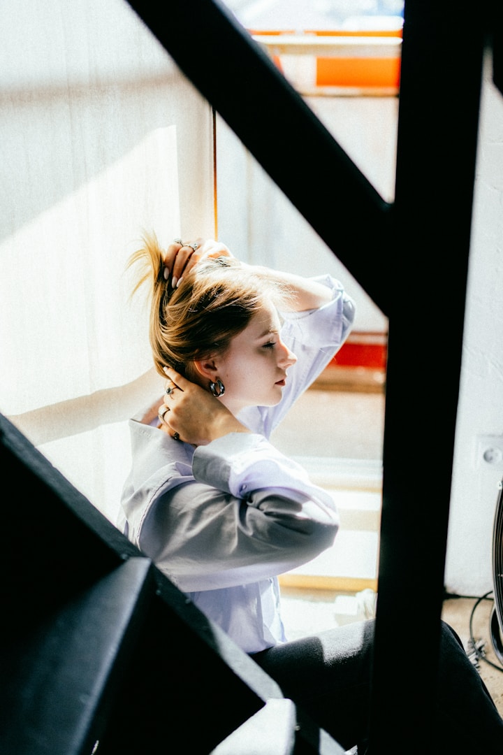 Office worker experiencing neck tension and stress contributing to chronic headaches needing osteopathic treatment