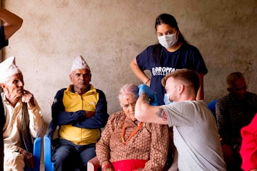 a group of people sitting next to each other